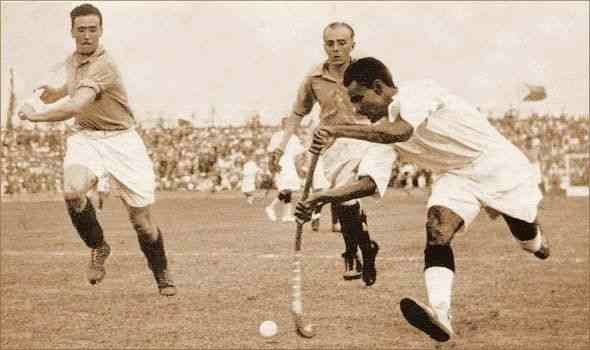 Dhyan Chand playing Hockey
